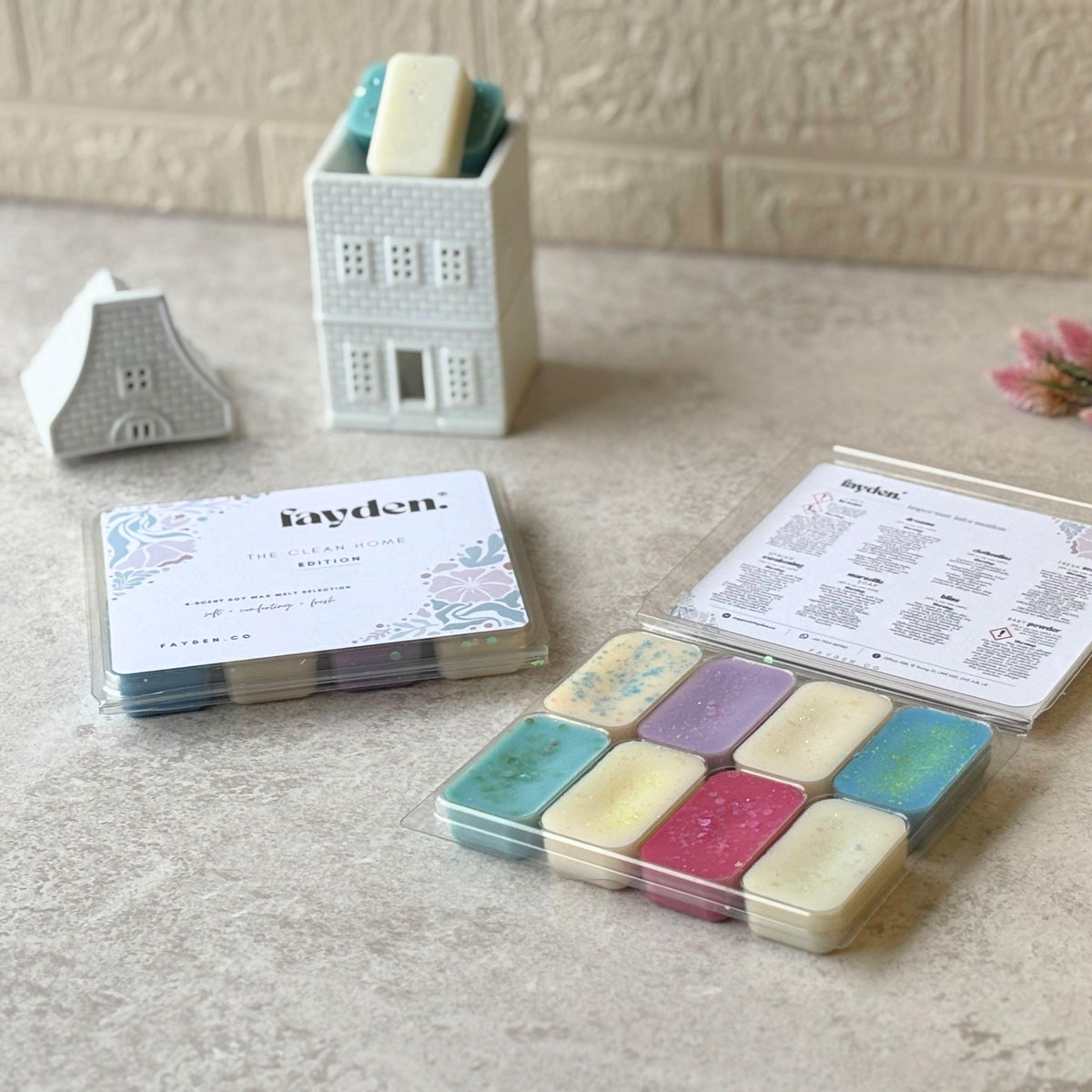 FAYDEN home fragrance scent guide featuring eight fragrances: Linen Breeze, Spring Awakening, Dreams, Marseille Soap, Clothesline, Bliss, Fresh Sea Air and Baby Powder. The elegant floral illustrated design describes each scent with notes of fresh cotton, green florals, soft woods, powdery warmth, clean air and gentle musk. A refined home fragrance collection created for quiet rituals, comforting moments and making home feel beautifully yours