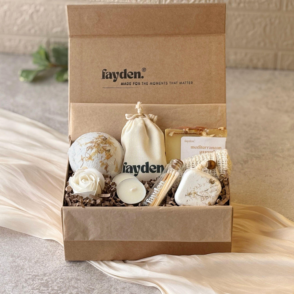 Wellness gift set with handmade soap, bath bomb and aromatherapy shower steamer, beautifully presented as a self care gift box for her. A thoughtful pamper gift, spa gift set or relaxing home fragrance gift for birthdays, Christmas, Mother's Day or a special treat. Choose the Essential or Complete wellness set, featuring FAYDEN handmade soaps, a branded pouch, tealights and matches, with a natural jute soap saver included. A lovely gift for women who enjoy slow, cosy self care rituals.